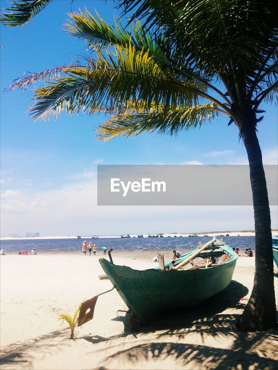 BOATS MOORED ON BEACH