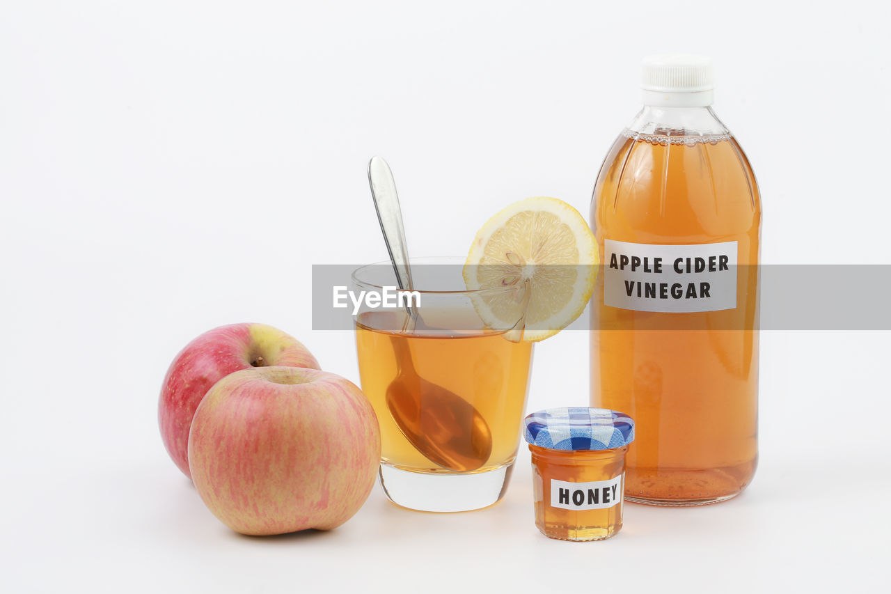 CLOSE-UP OF FRUITS IN GLASS ON TABLE