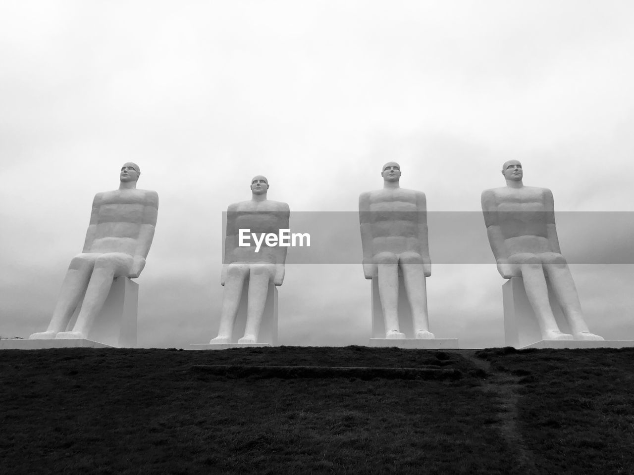 STATUE AGAINST SKY IN ROW