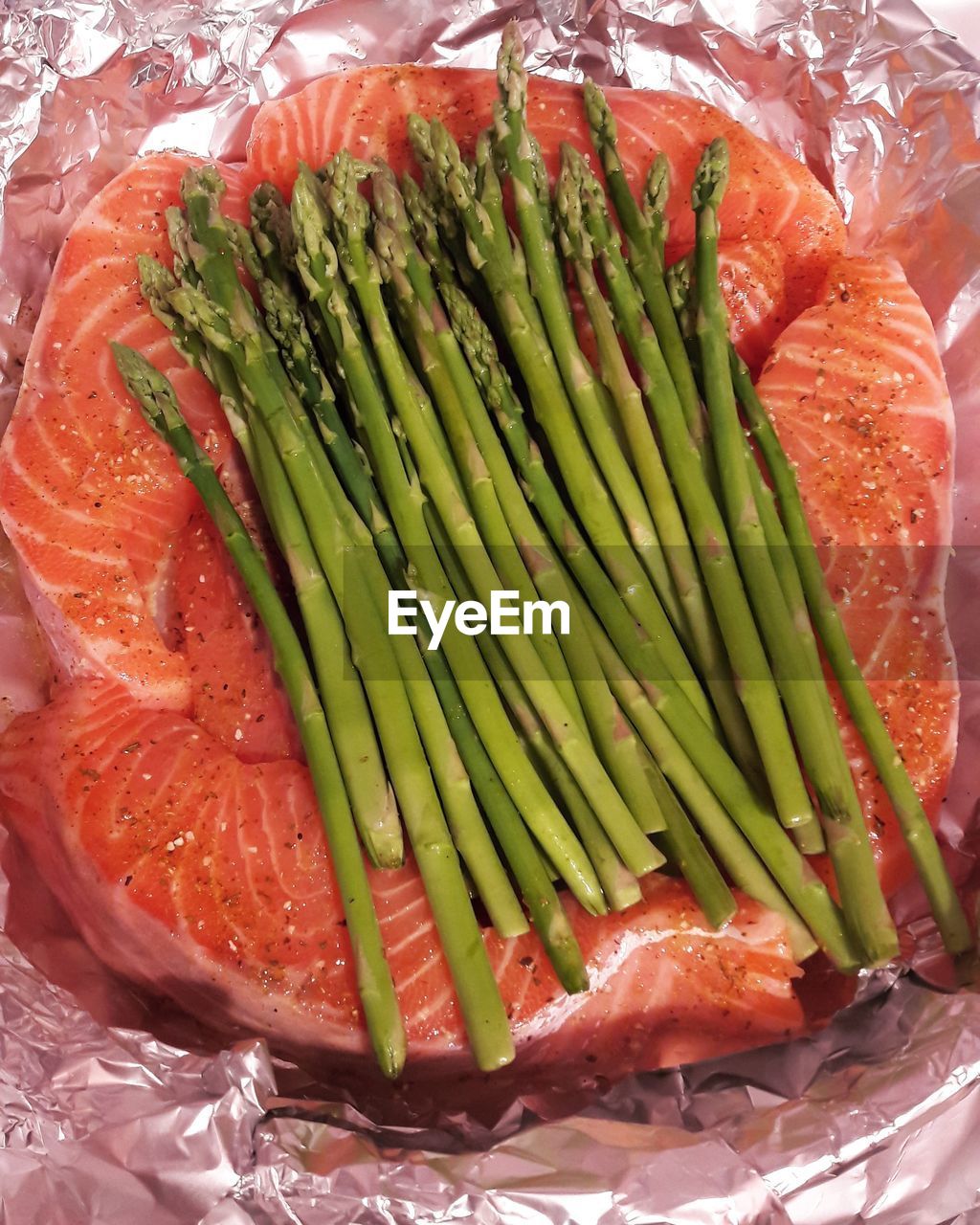 Close-up of asparagus with salmon in bowl