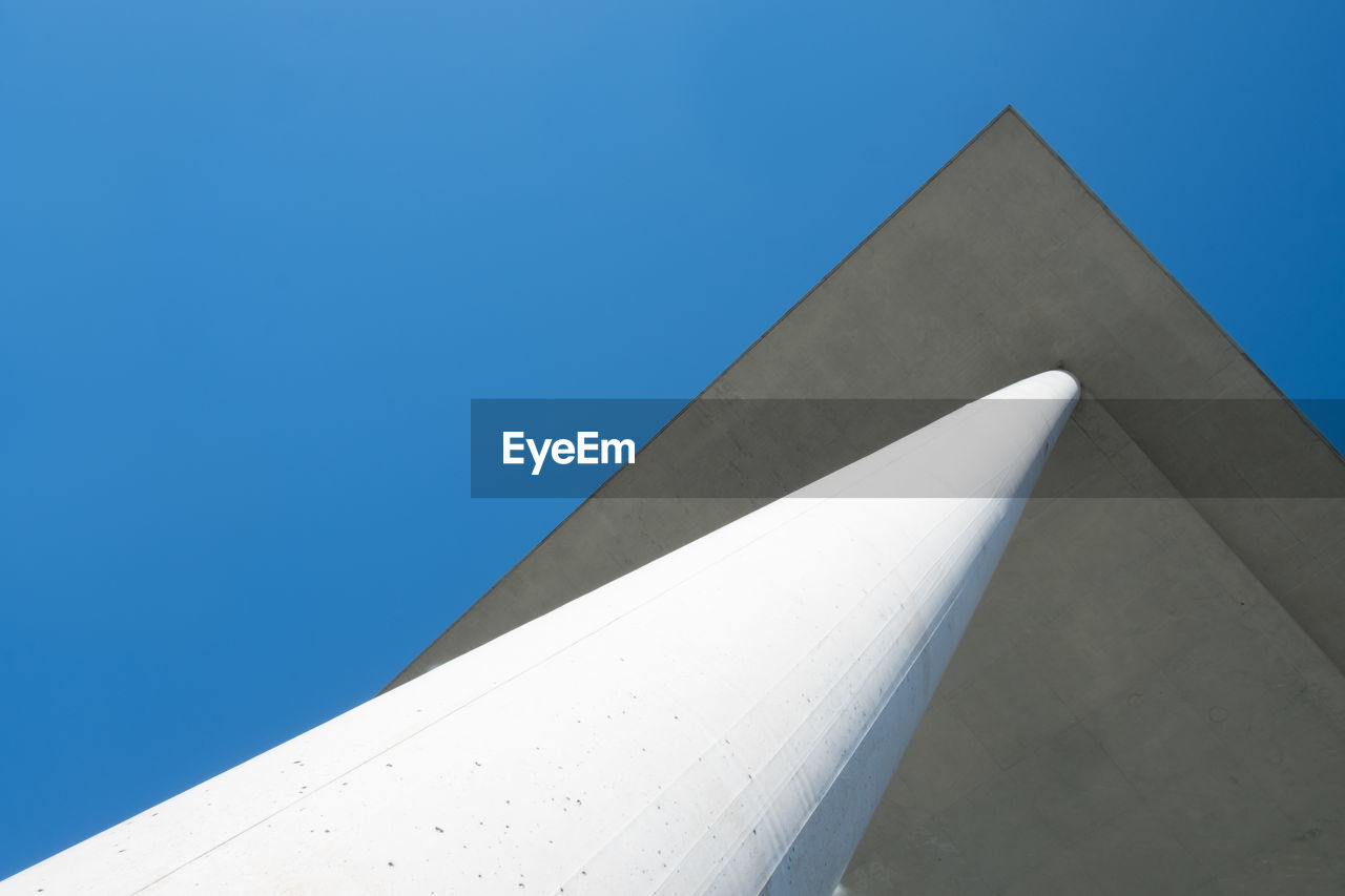 Low angle view of building against blue sky