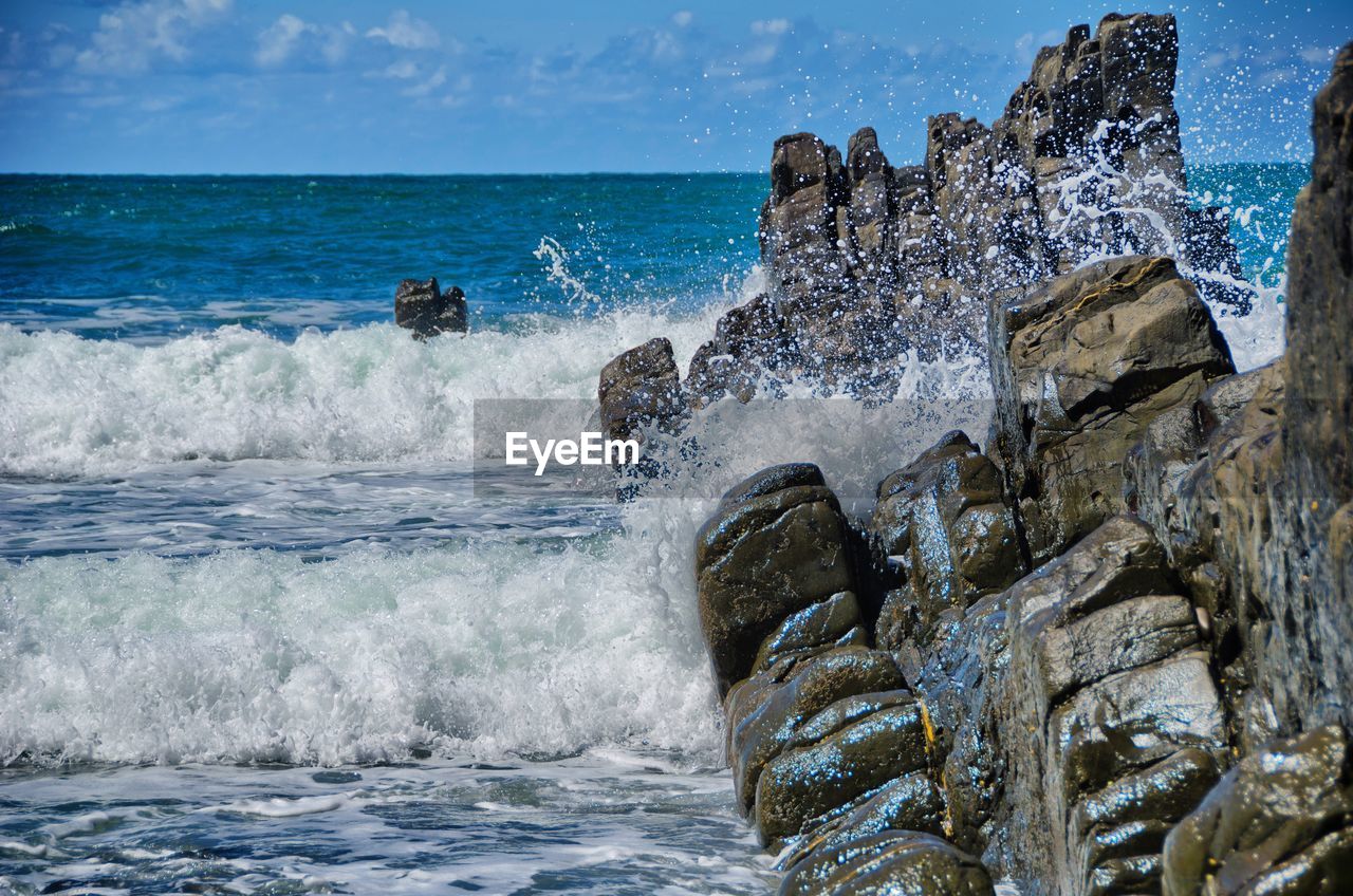 Waves splashing on rocks