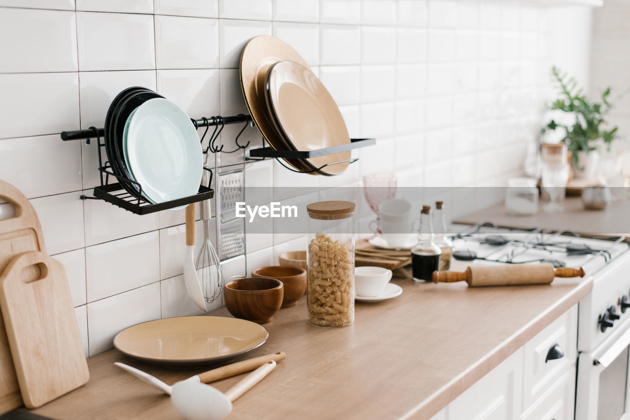 Kitchen utensils are on the cabinet. the interior of the room in the scandinavian style