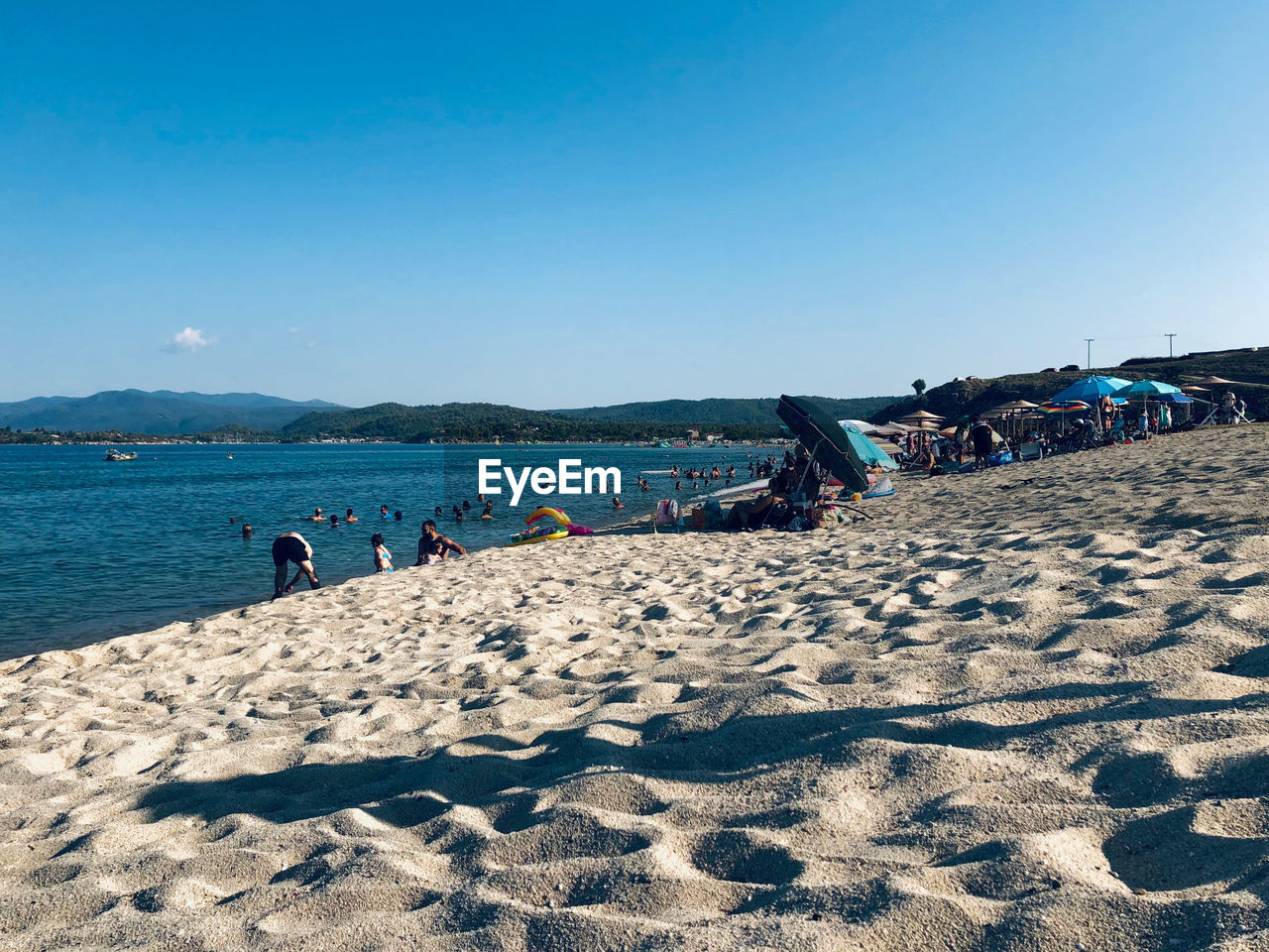 GROUP OF PEOPLE ON BEACH