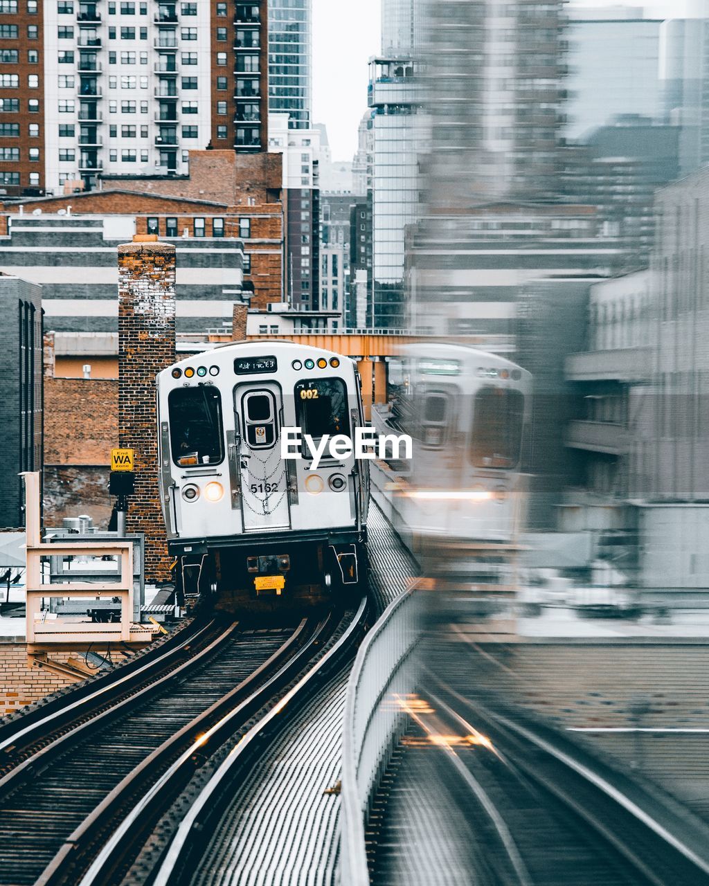 BLURRED MOTION OF TRAIN AT CITY