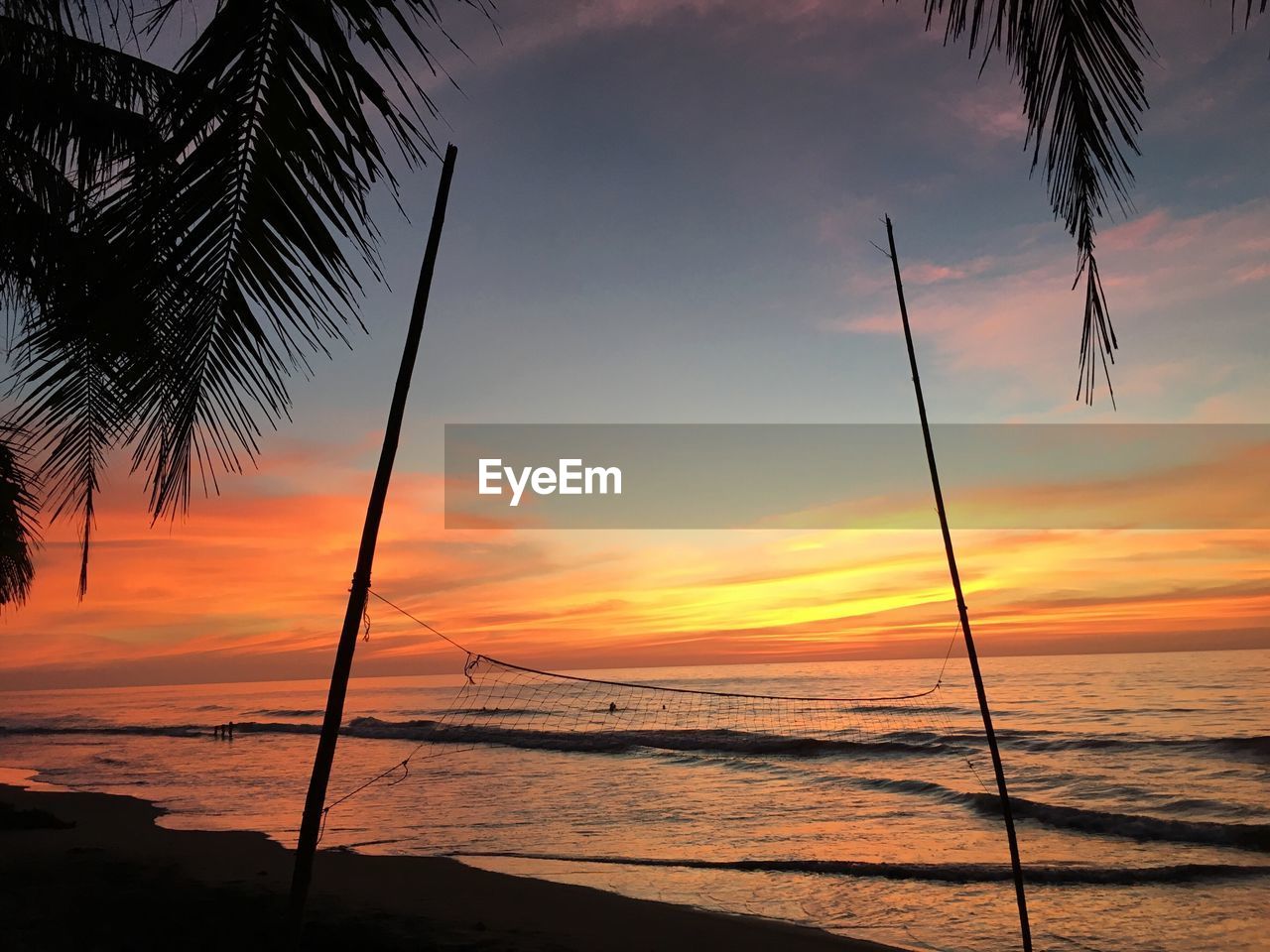 Scenic view of sea against sky at sunset