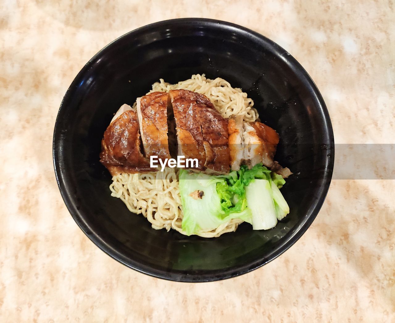 High angle view of food in plate on table roast duck noodels