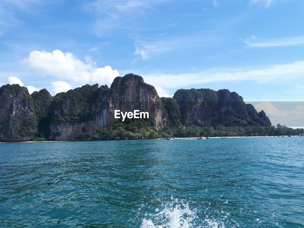 Scenic view of sea and rocks against sky