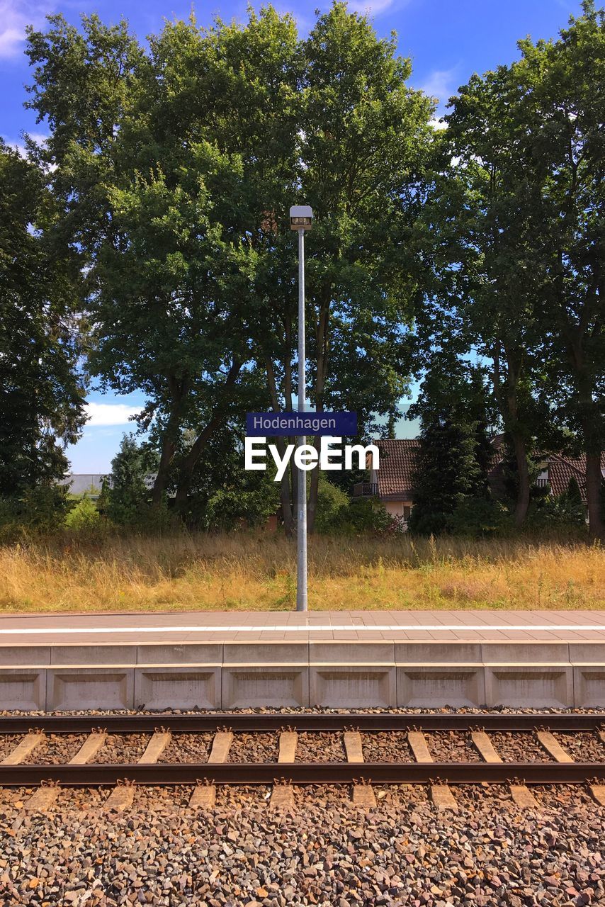 Hodenhagen text on street light at railroad station platform