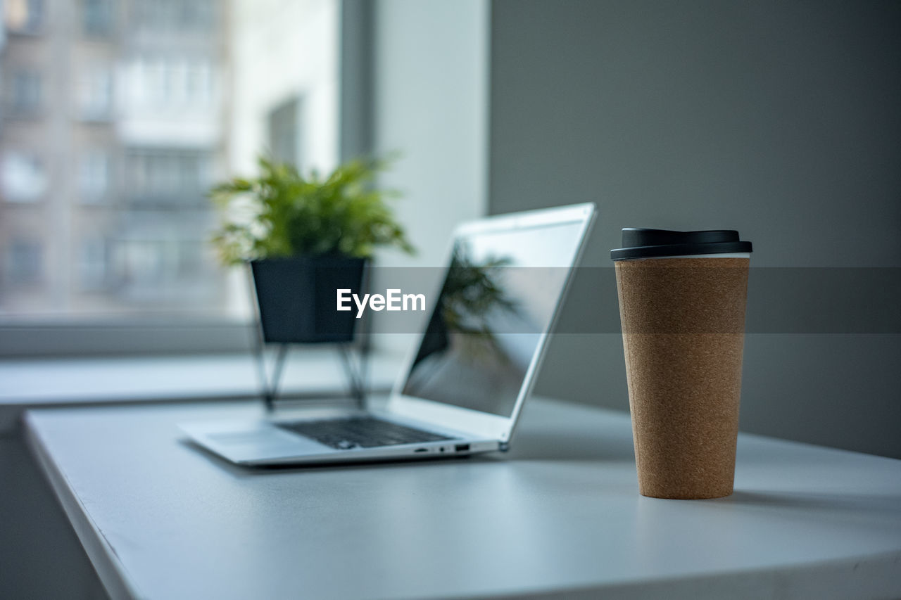 COFFEE CUPS ON TABLE