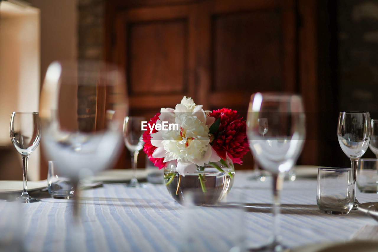 Close-up of wineglasses on table