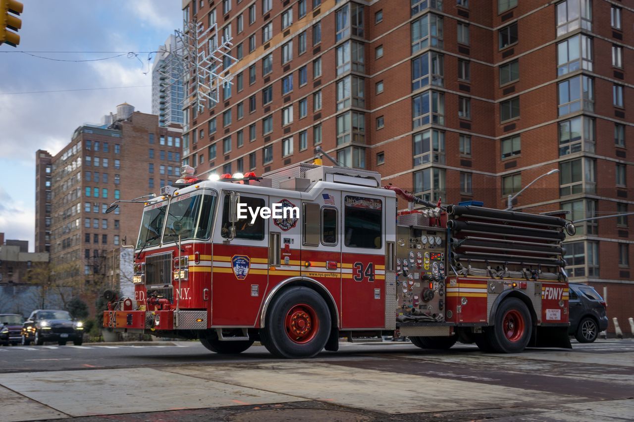 VEHICLES ON CITY STREET AGAINST BUILDINGS