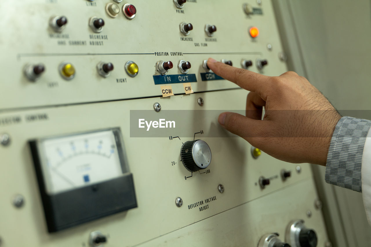 cropped hand of man holding equipment