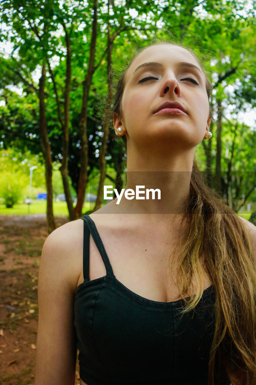 Close-up of young woman in park