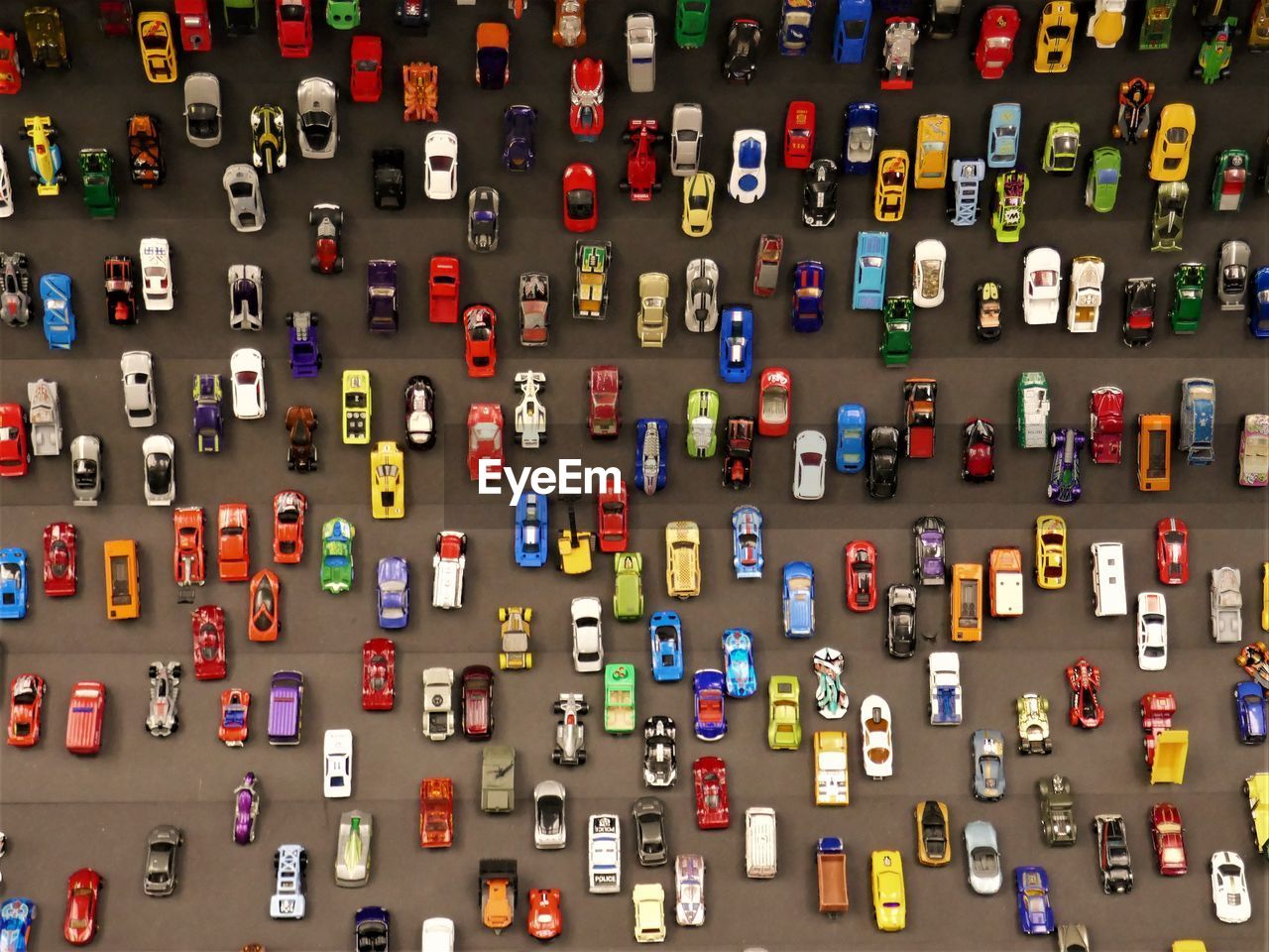 A lot of colorful matchbox cars in an exhibition in berlin.