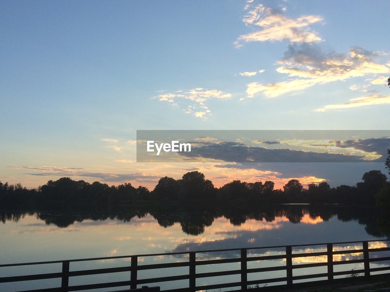 SCENIC VIEW OF RIVER AT SUNSET