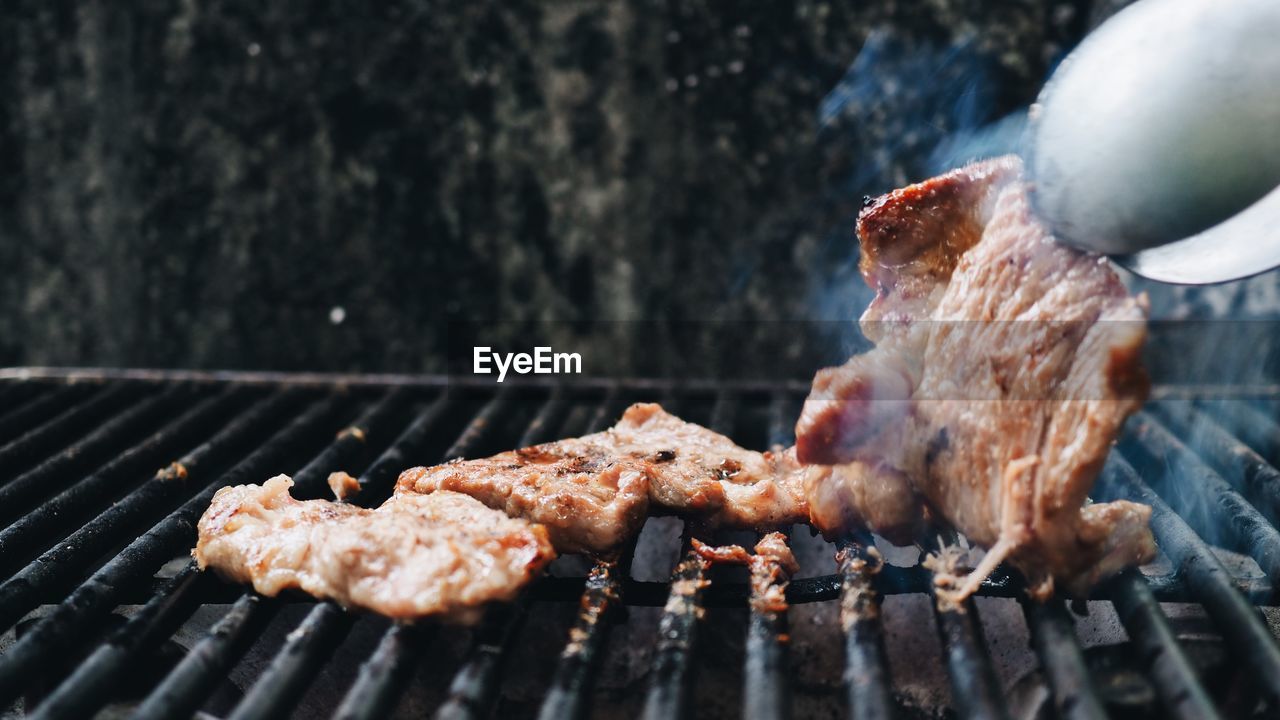 Close-up meat on barbecue grill