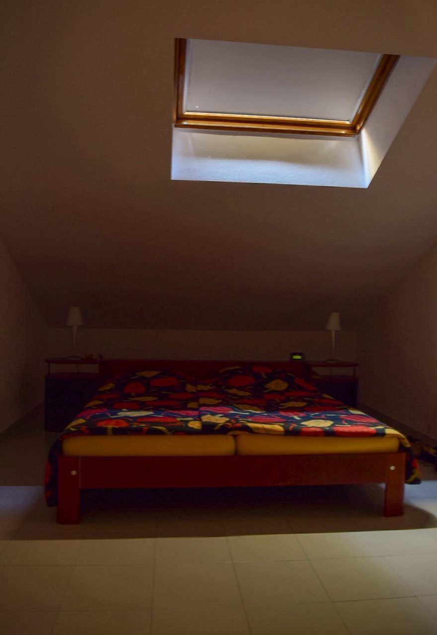 CLOSE-UP OF BED ON BEDROOM AT HOME
