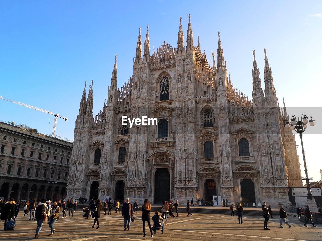 Group of people in front of milan cathedral