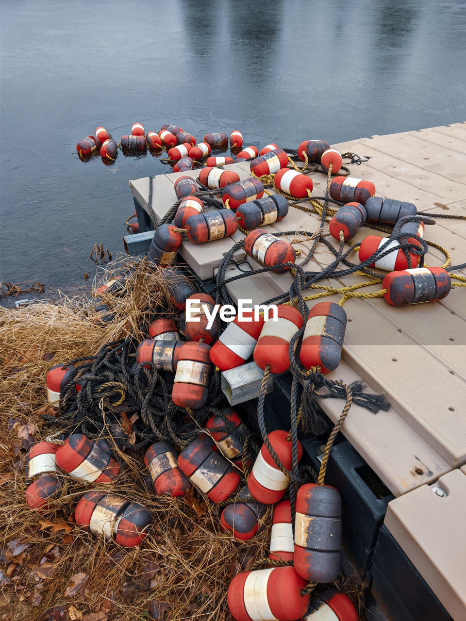 HIGH ANGLE VIEW OF RED FISHING NET ON SHORE