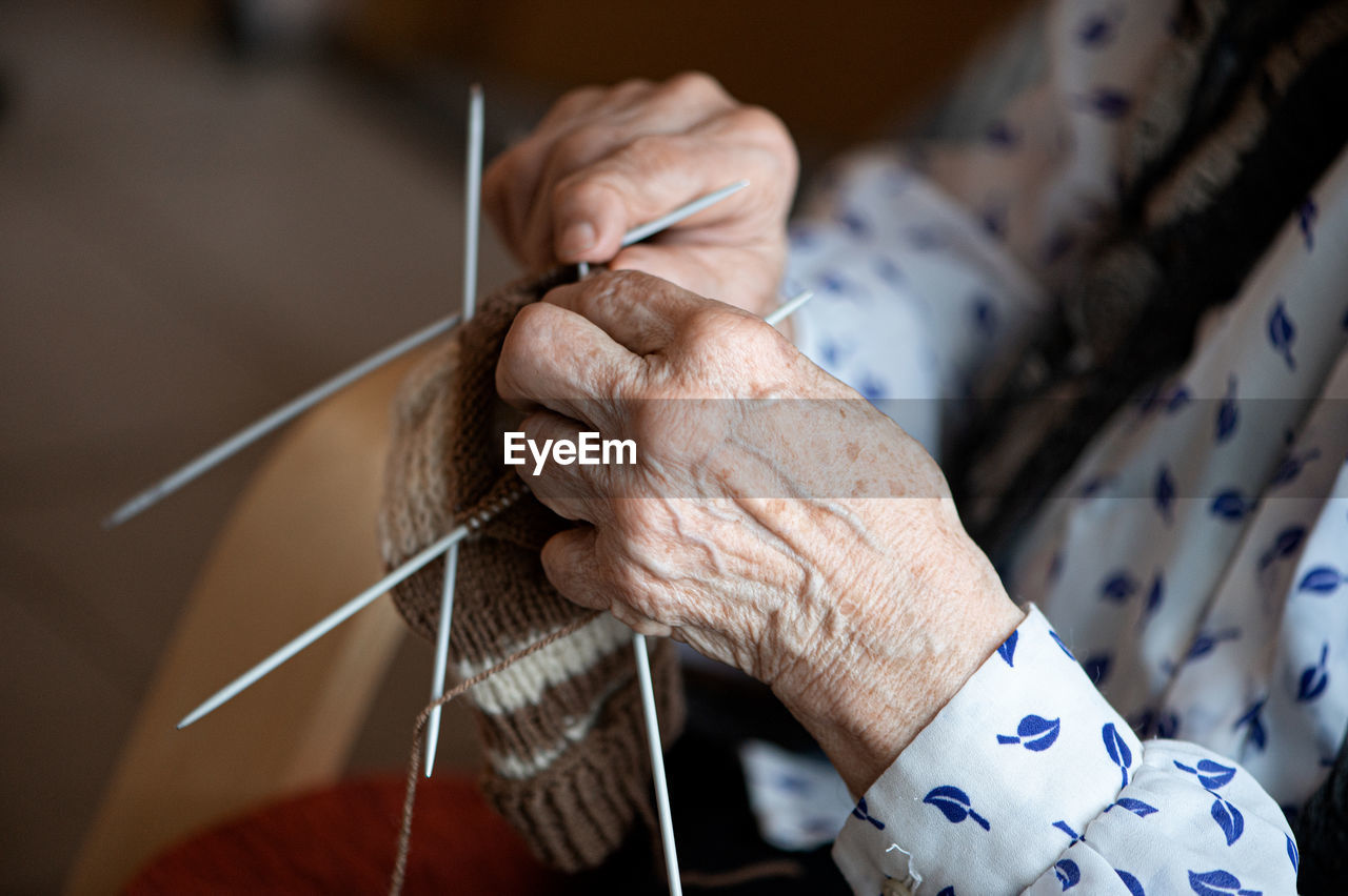 Midsection of woman crocheting