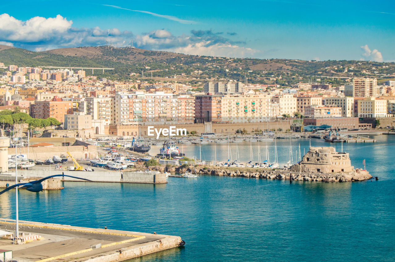 View of civitavecchia, rome's cruise and ferry port. city in the background, sunny day, view from 