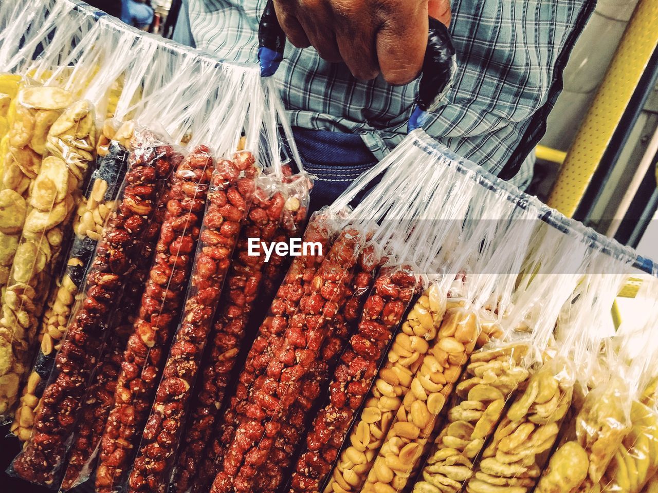 Close-up of sugary and salty peanuts for sale in market