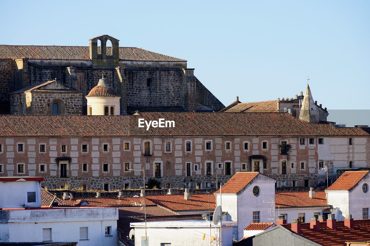 architecture, building exterior, built structure, building, town, city, roof, travel destinations, history, sky, the past, house, residential district, clear sky, nature, place of worship, travel, no people, tourism, religion, château, sunny, old, blue, tower, outdoors, cityscape, day, landmark