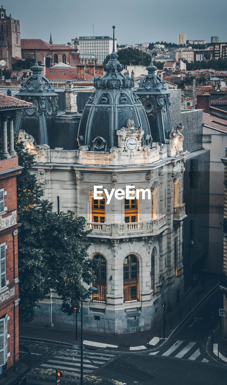 High angle view of buildings in city at dusk