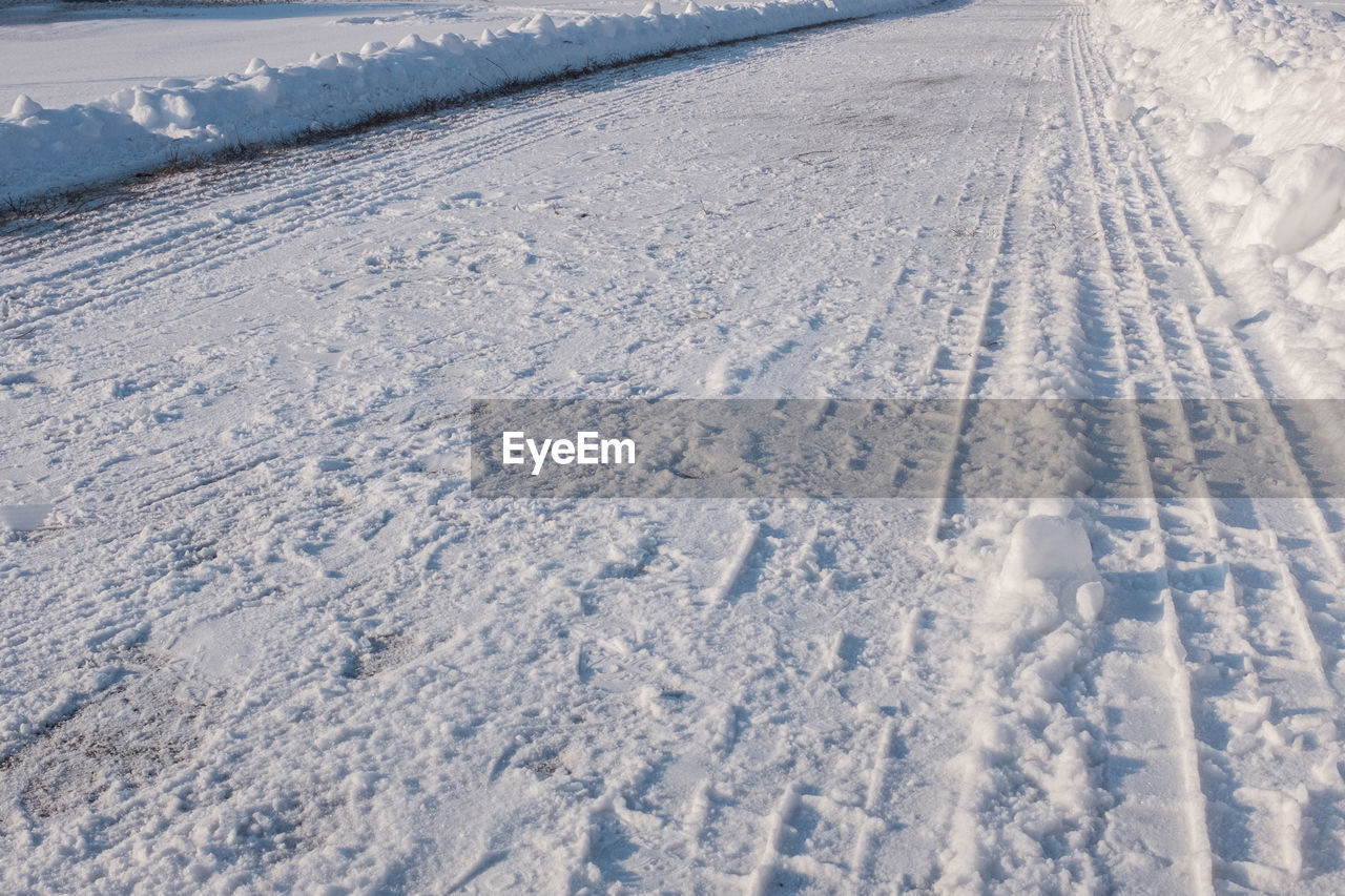 A snow-covered road in the winter season