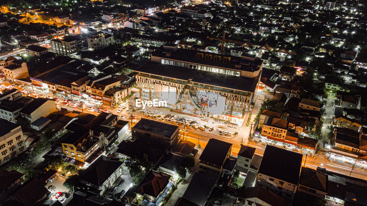 High angle view of illuminated buildings in city