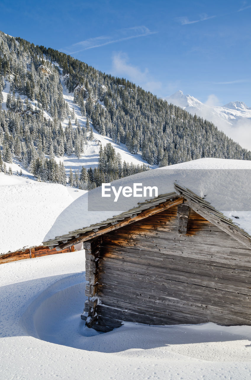 Scenic view of snow covered mountain against sky