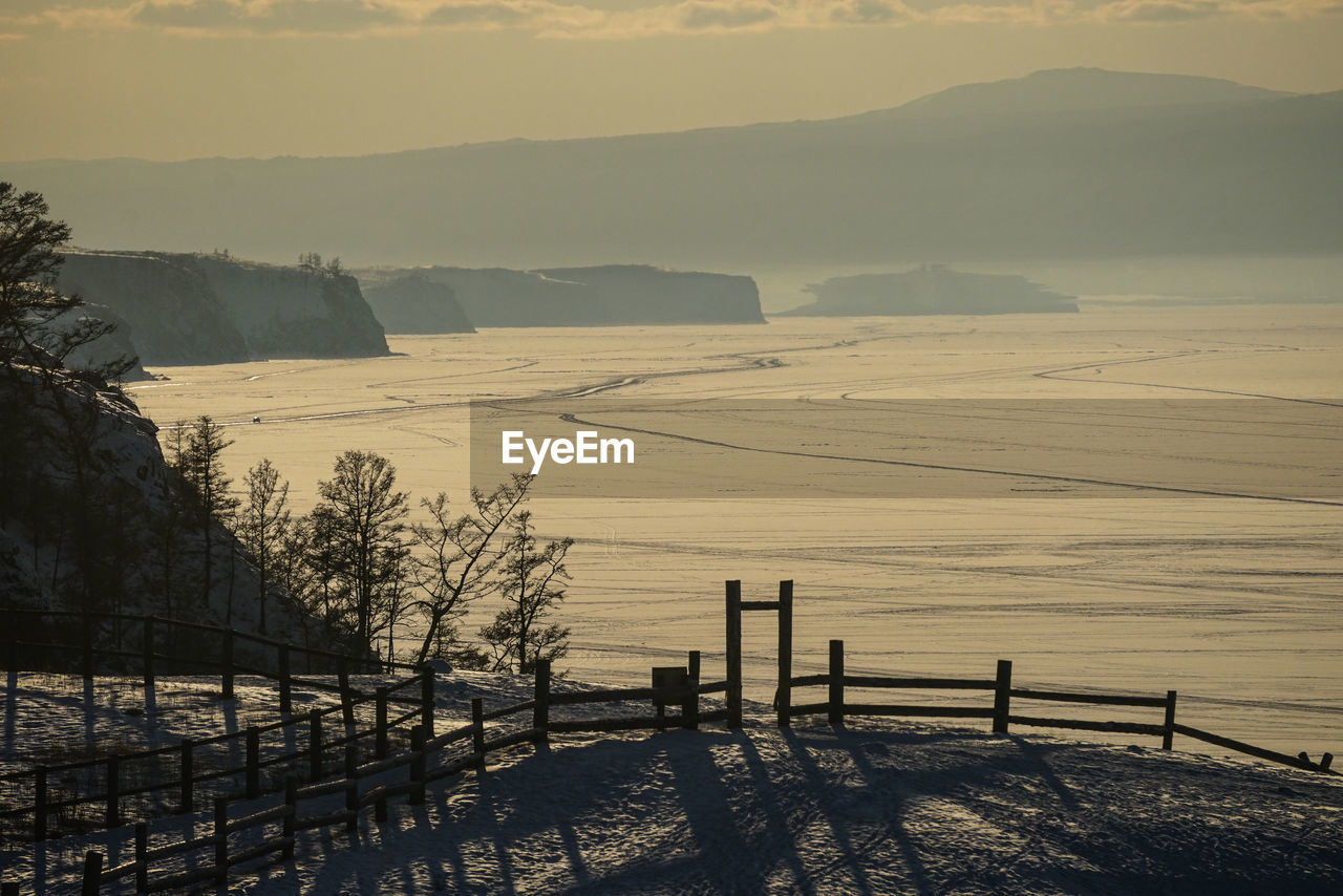 Scenic view of snowcapped mountains against sky during winter