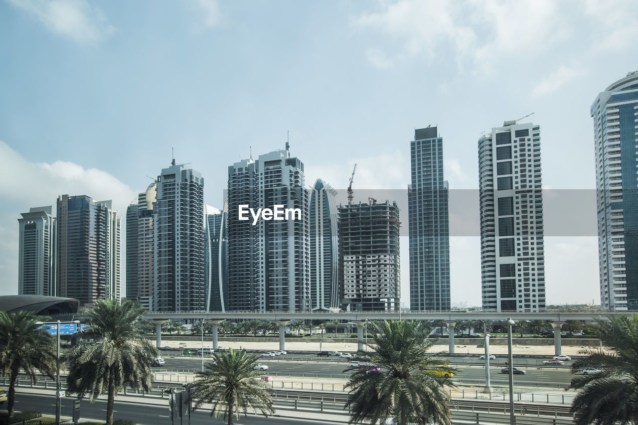 Modern buildings in city against sky