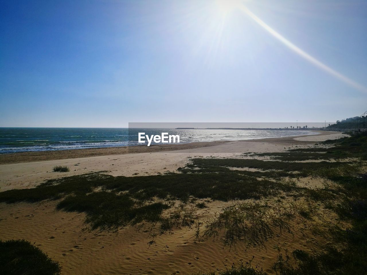 BEACH AGAINST SKY