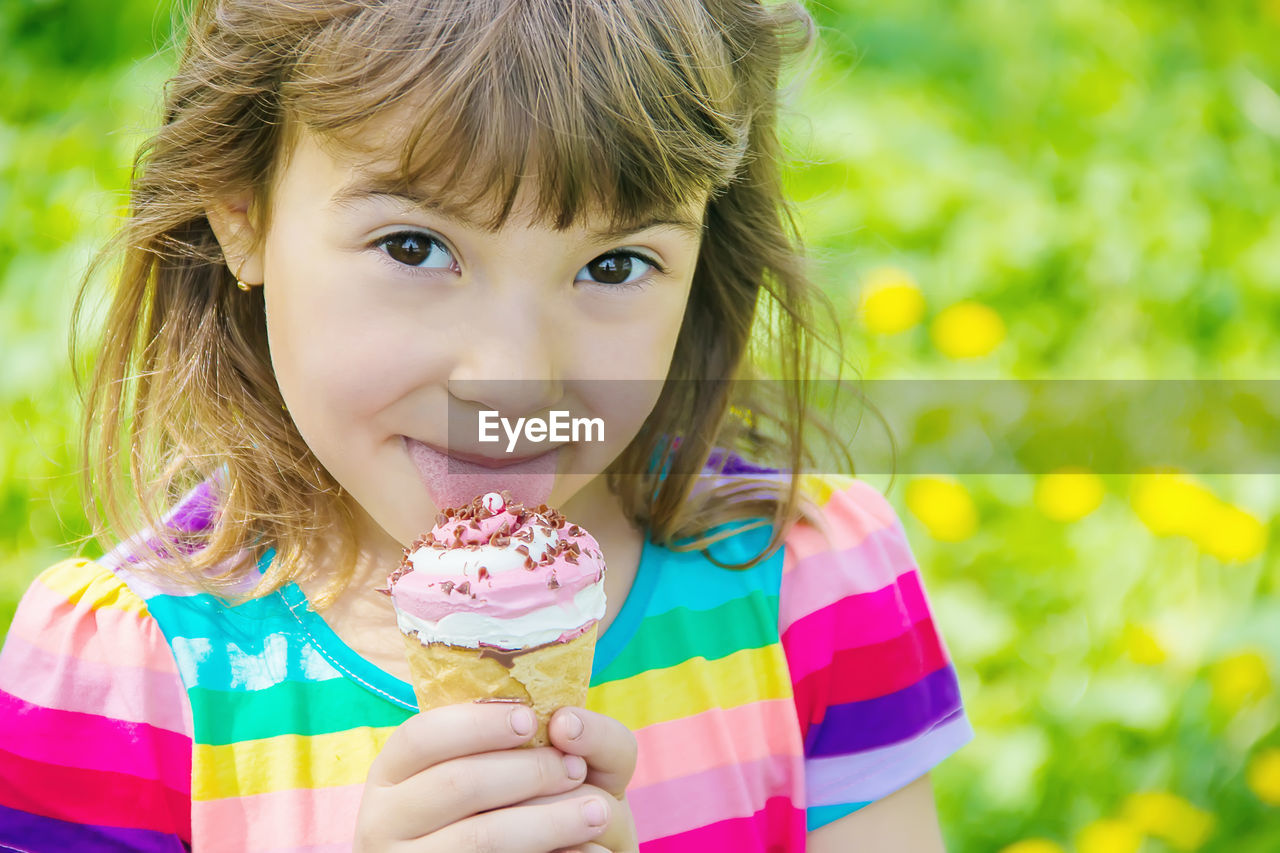 childhood, child, portrait, sweet food, sweet, food, food and drink, one person, summer, looking at camera, cute, toddler, smiling, women, female, frozen food, happiness, ice cream, person, dessert, cone, ice cream cone, holding, front view, innocence, emotion, frozen, headshot, nature, dairy, multi colored, freshness, eating, portrait photography, enjoyment, flower, fun, day, outdoors, human face, cheerful, sweetness, skin, casual clothing, grass, pink, hairstyle, plant