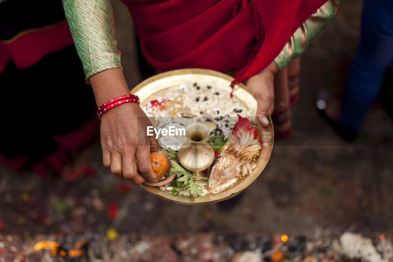 Close up of woman holding tray