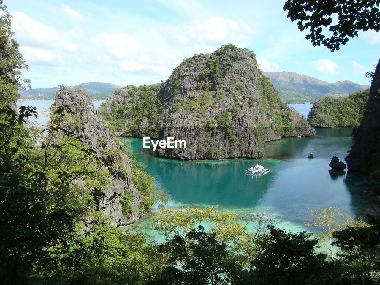 High angle view of rock formations in sea at coron