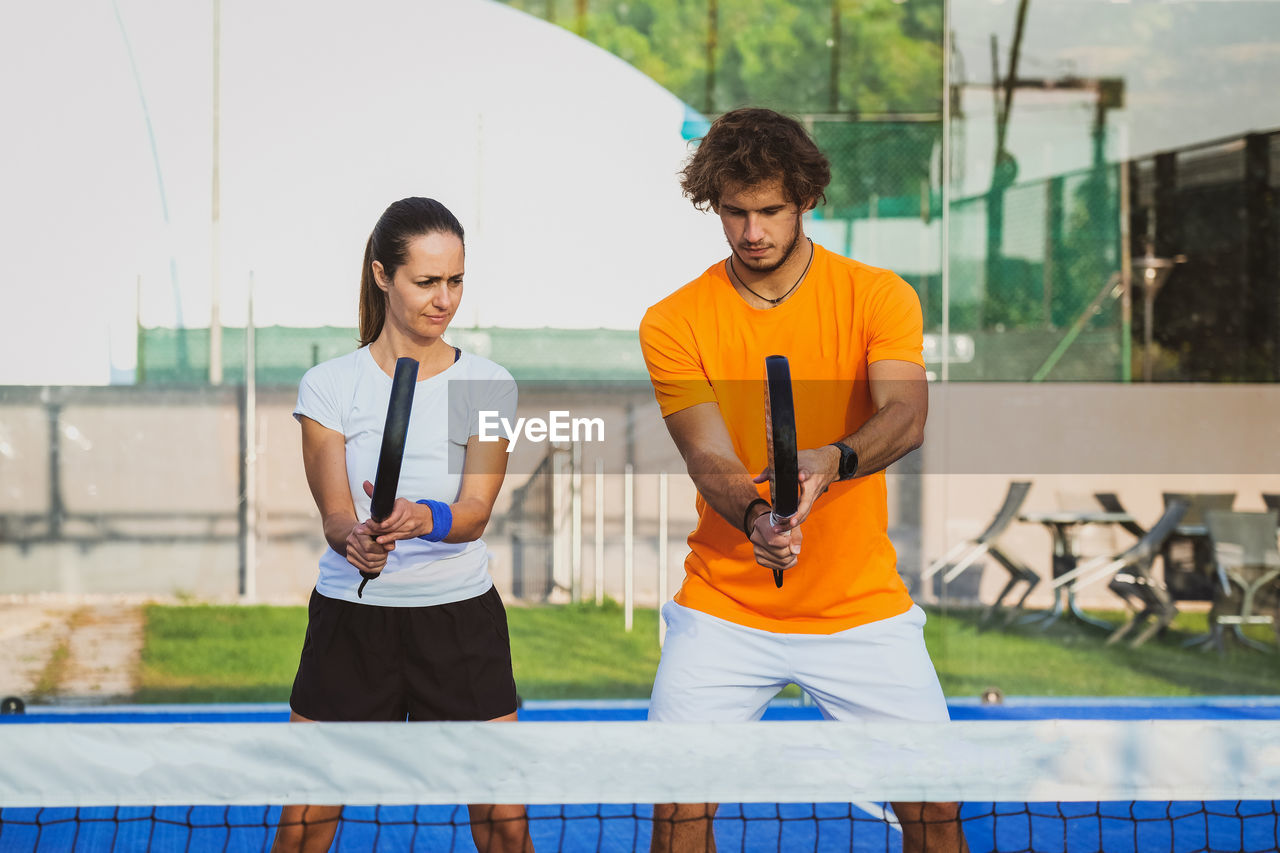 Tennis players playing at court