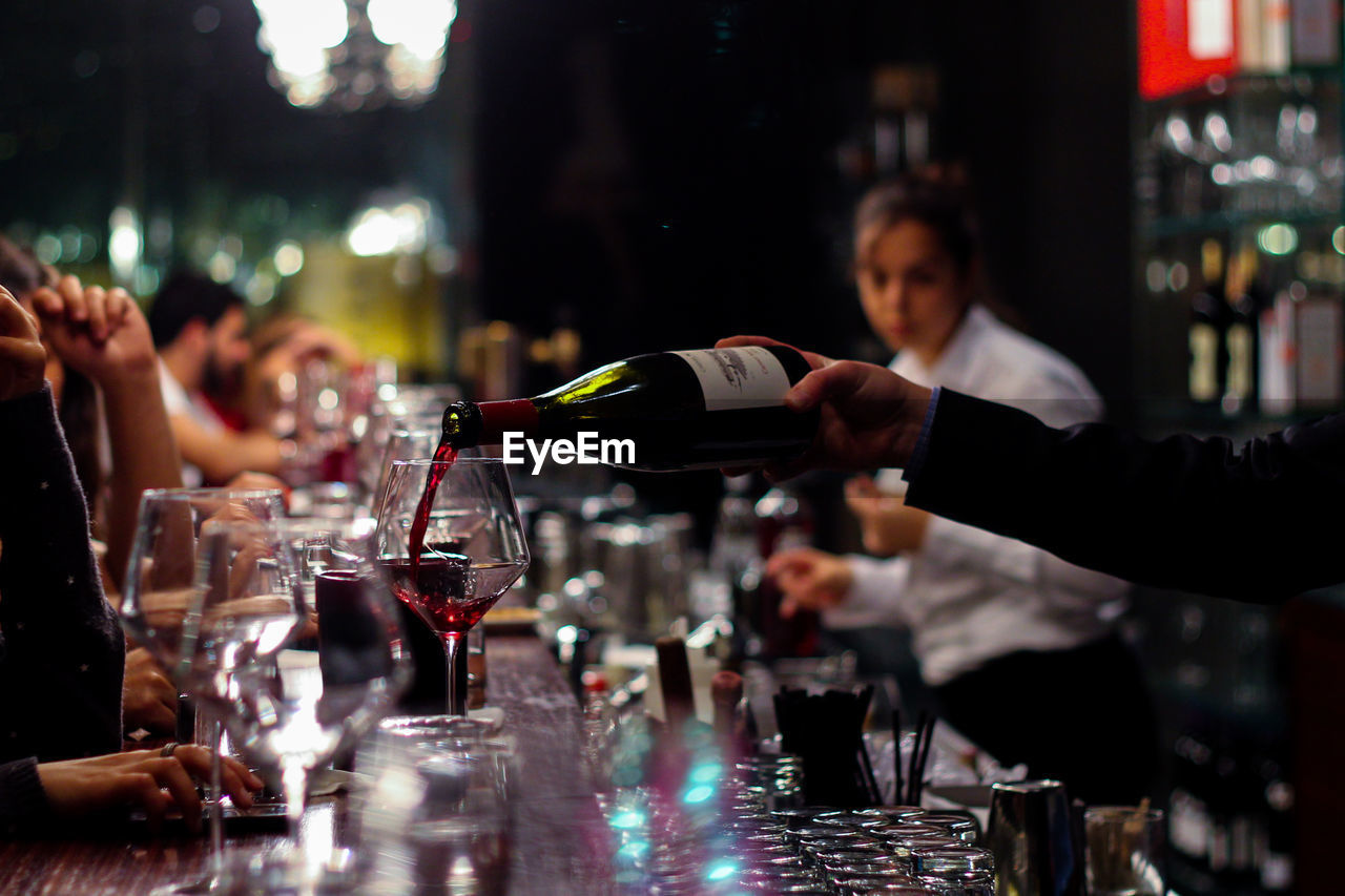 Close-up of pouring wine into glass