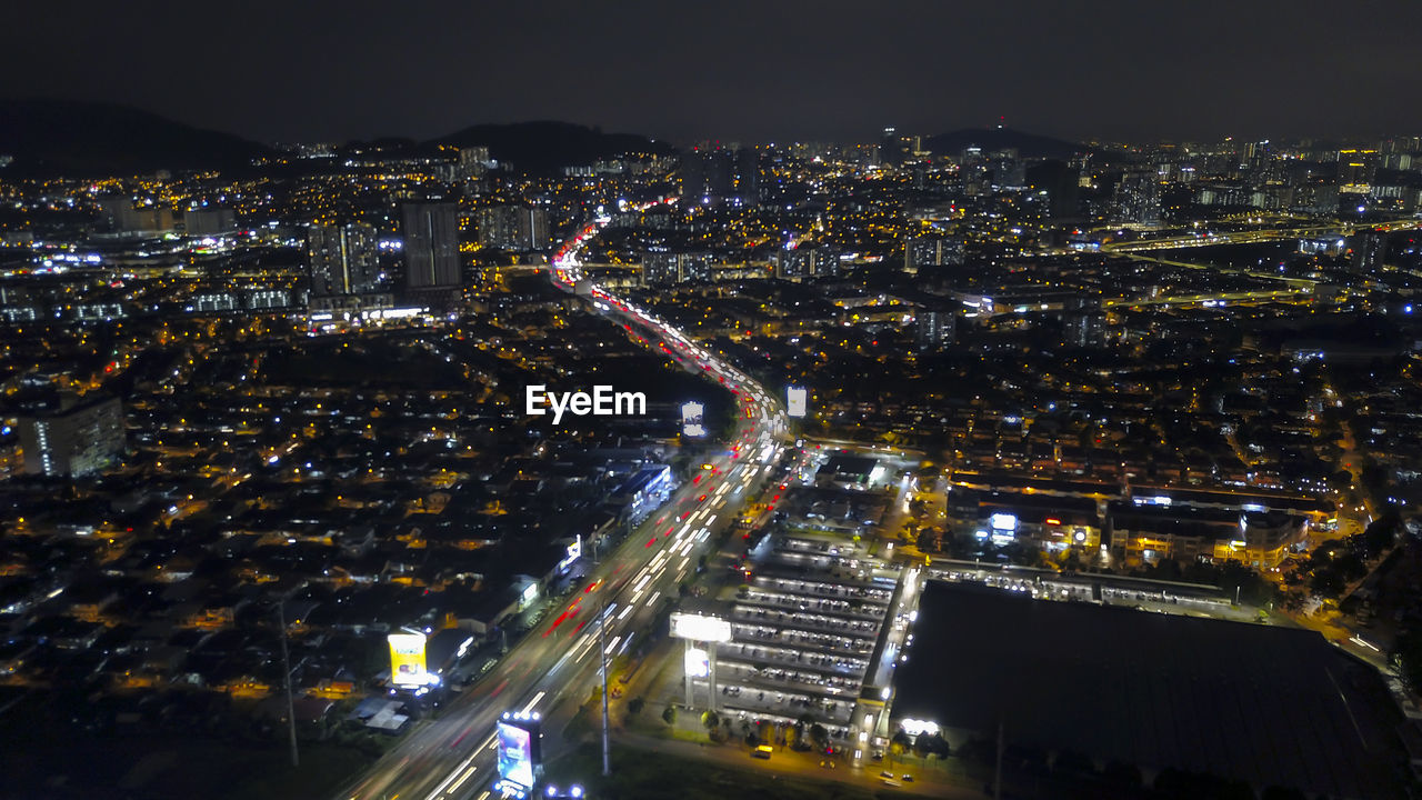 High angle view of illuminated city street at night