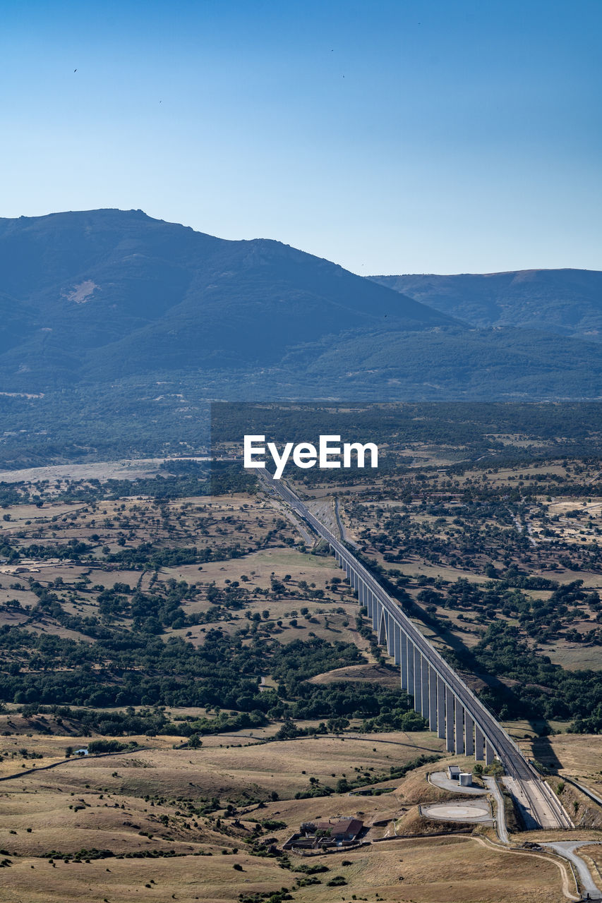 HIGH ANGLE VIEW OF ROAD AGAINST SKY