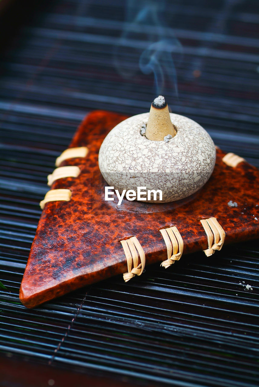 High angle view of incense on table