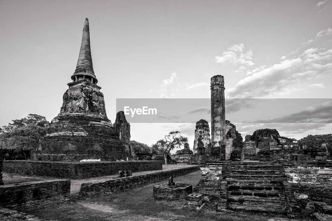 Low angle view of ruined structure against the sky