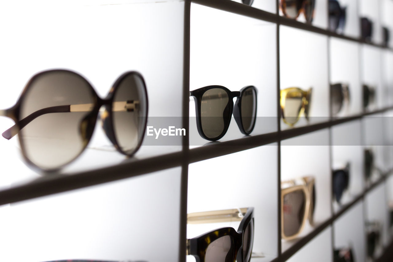 Full frame shot of sunglasses on shelf at store