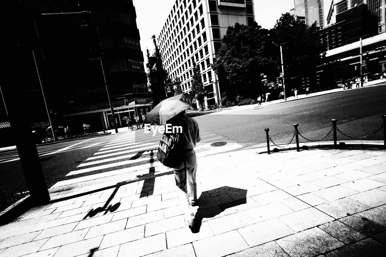 People walking on street in city