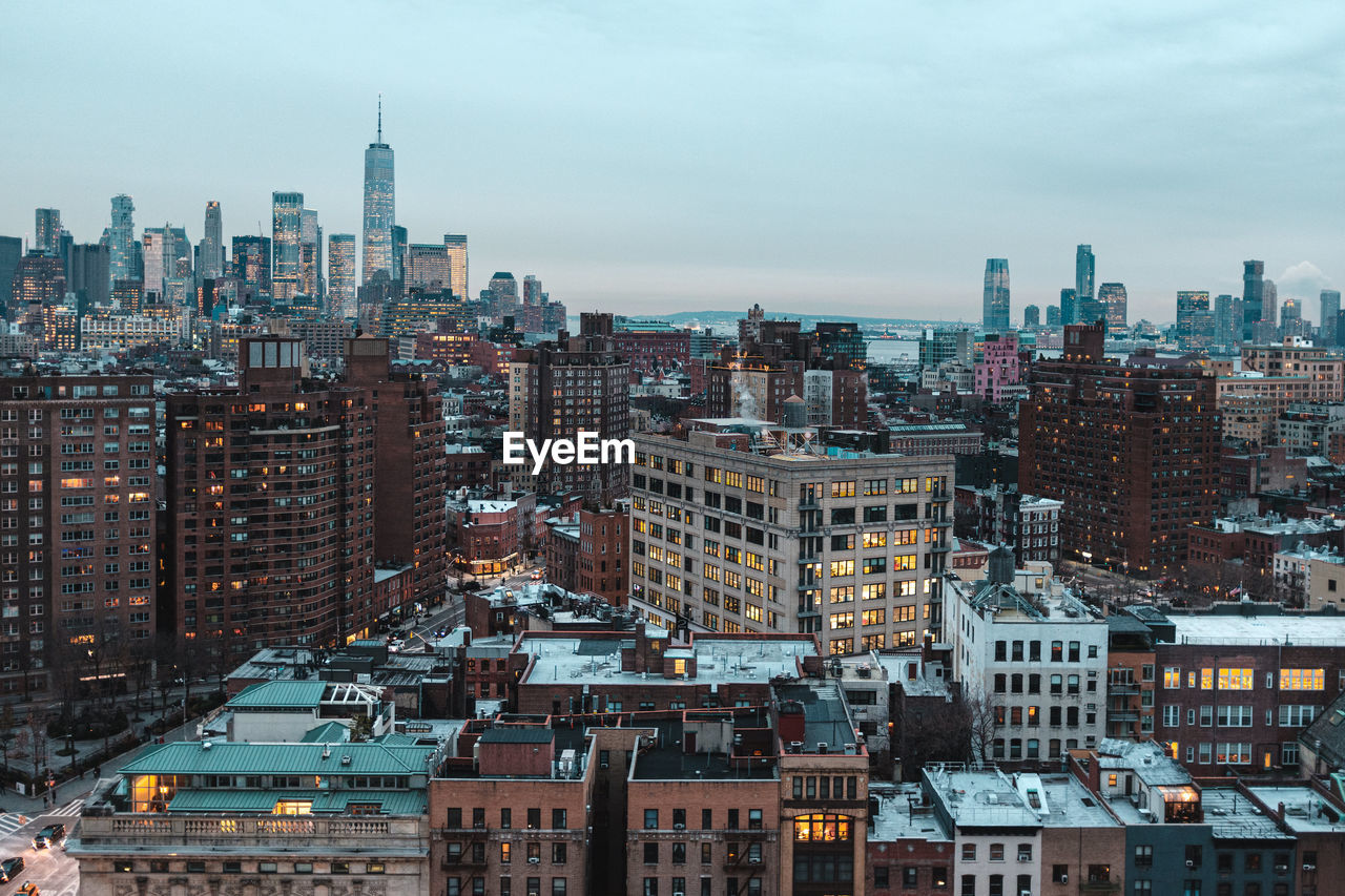 HIGH ANGLE VIEW OF BUILDINGS AGAINST SKY