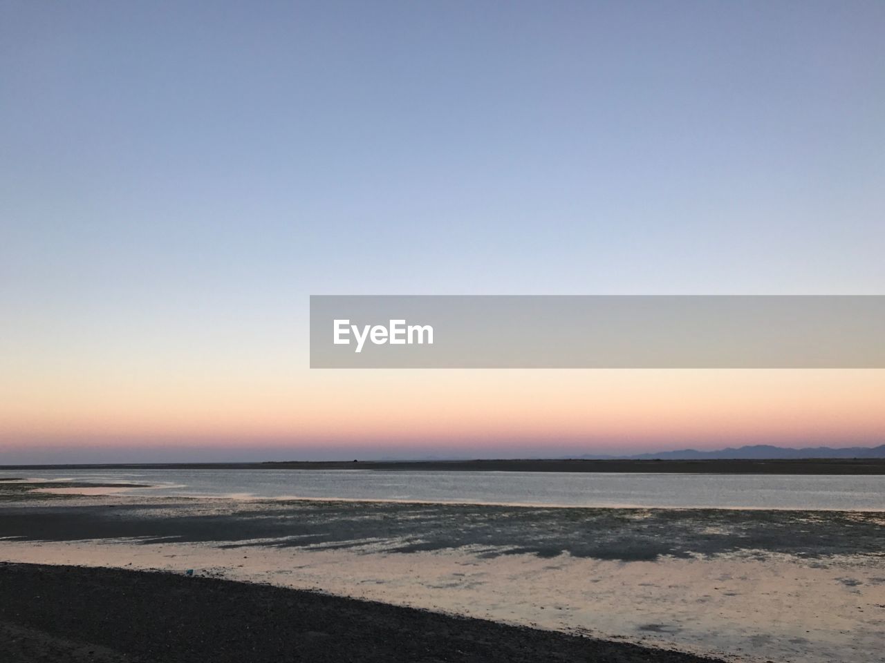 View of beach at sunset