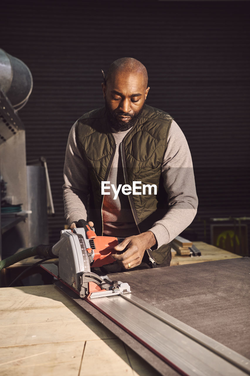 Carpenter working at workshop