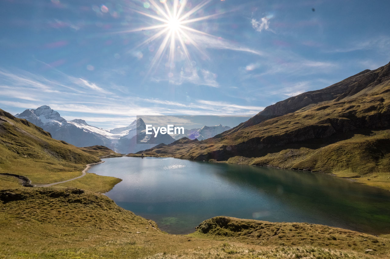 Scenic view of lake surrounded by mountain